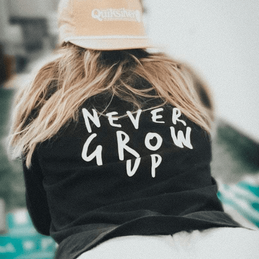 Never Grow Up Unisex Short Sleeve Adults T-Shirt