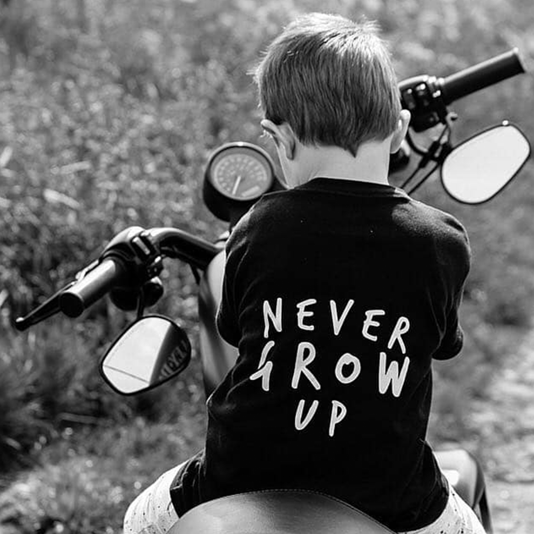 Never Grow Up Unisex Short Sleeve Kids T-Shirt